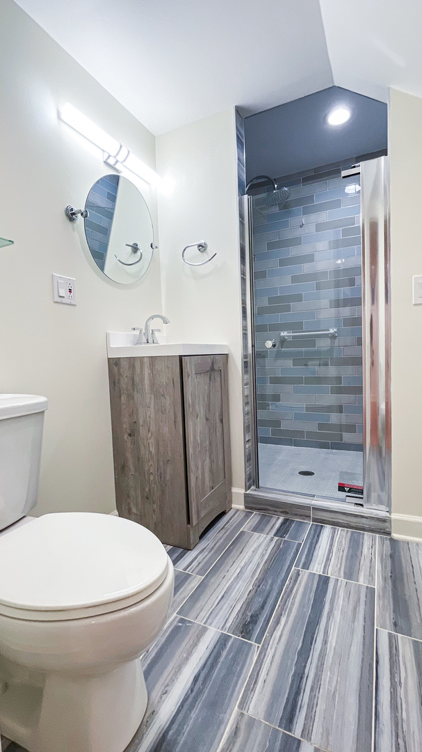 1640 Barry Lane Glenview, IL 60025 - Photo 36 of 42 a bathroom with a toilet and a shower