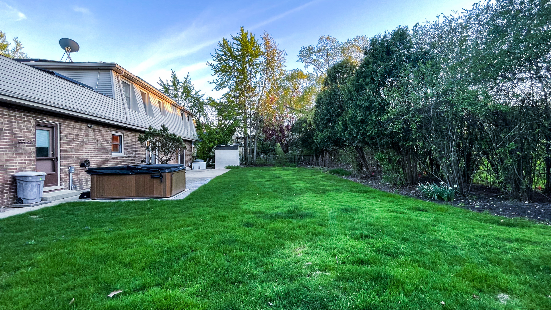 1640 Barry Lane Glenview, IL 60025 - Photo 40 of 42 a view of a house with a yard porch and sitting area