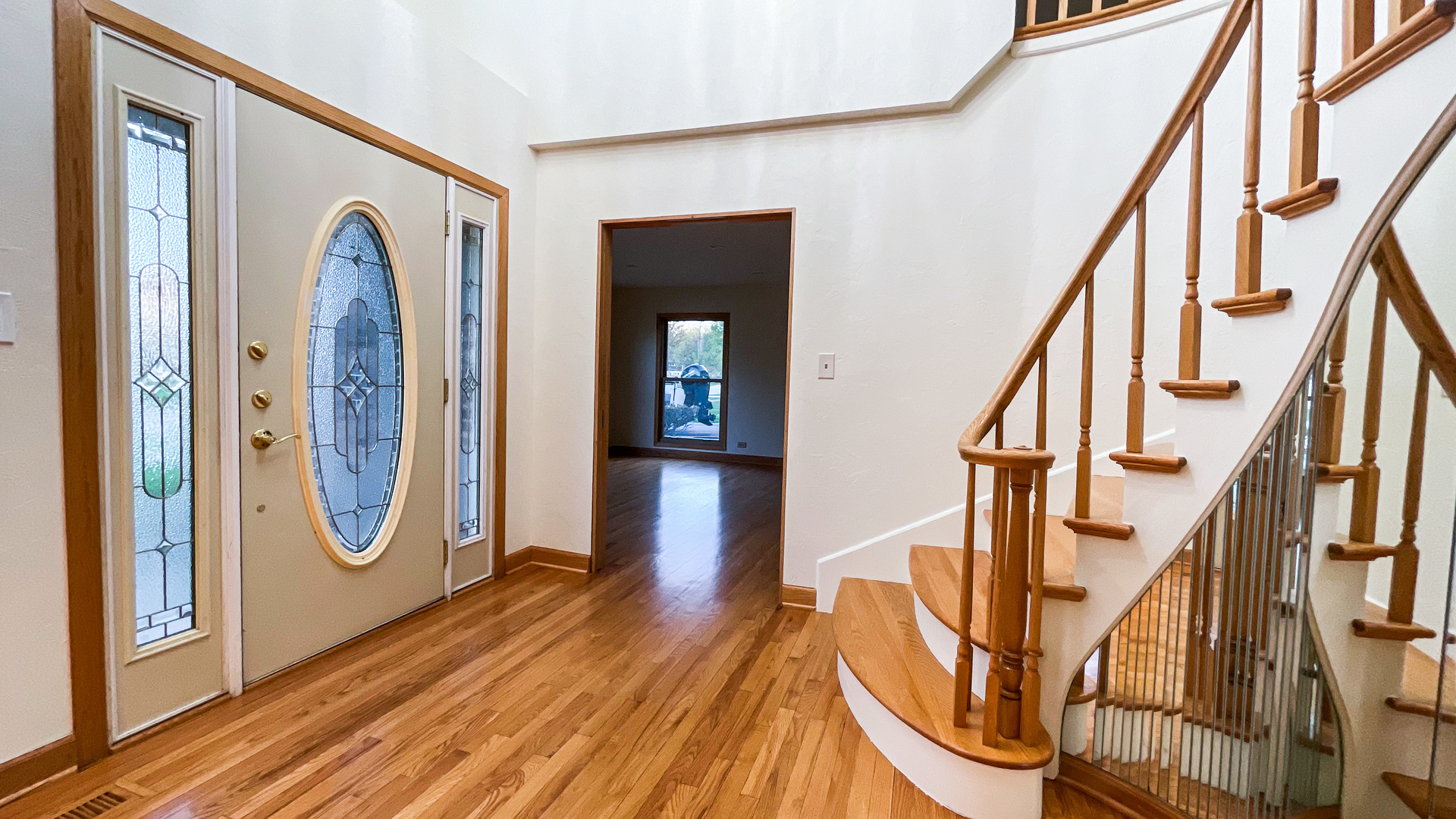 1640 Barry Lane Glenview, IL 60025 - Photo 4 of 42 a view of an entryway with wooden floor and front door