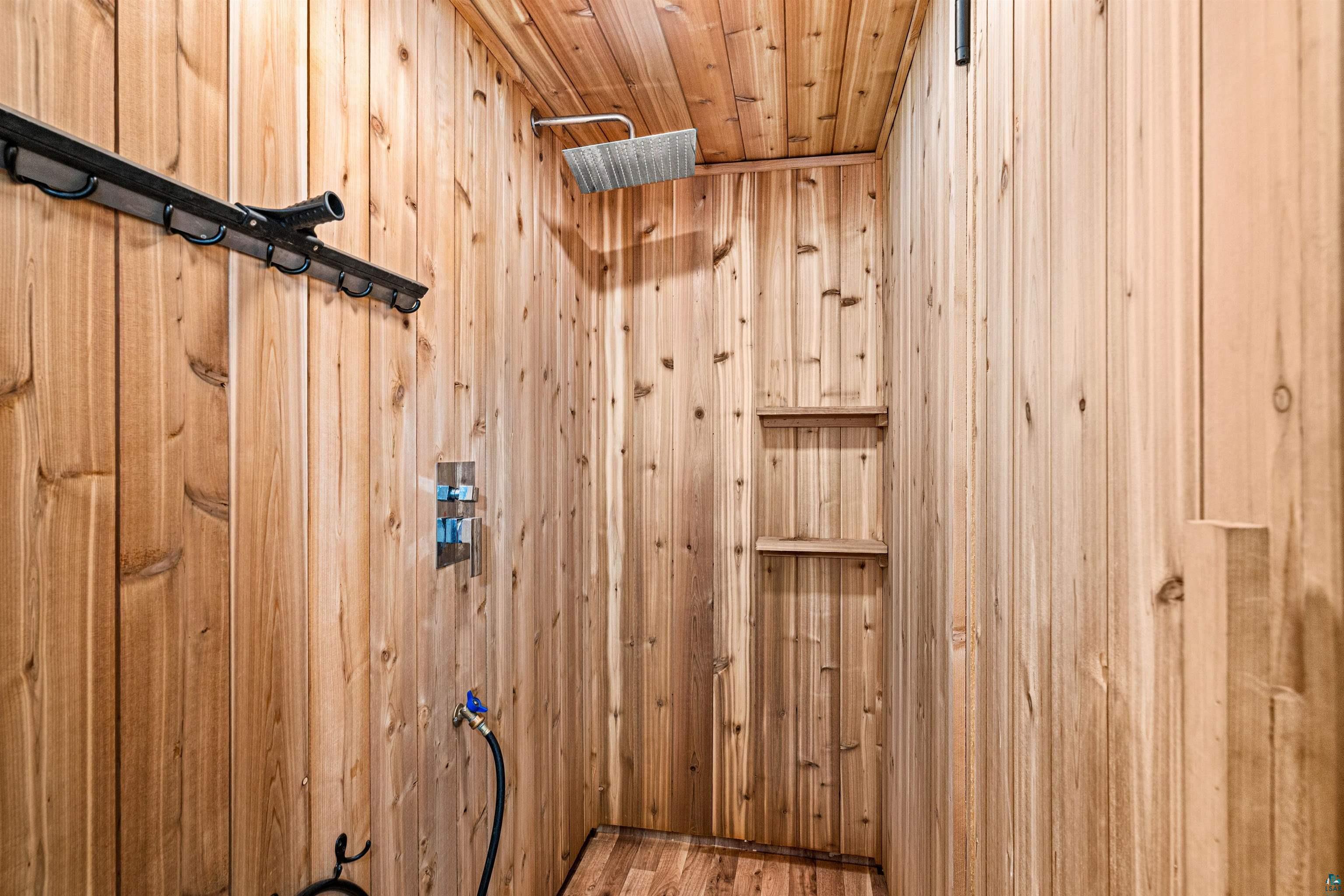 1825 East Shilhon Road Duluth, MN 55804 - Photo 21 of 37 Cedar shower enclosure and featuring a ceiling-mounted rainfall showerhead.