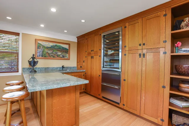 a outdoor dining space with furniture and wooden floor