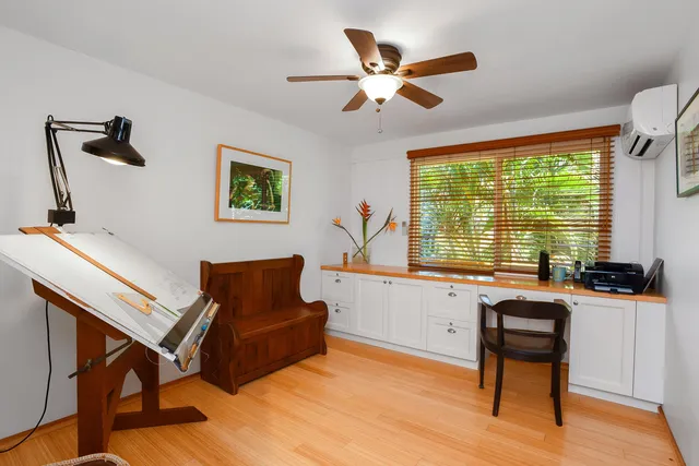 a bathroom with a sink mirror and vanity