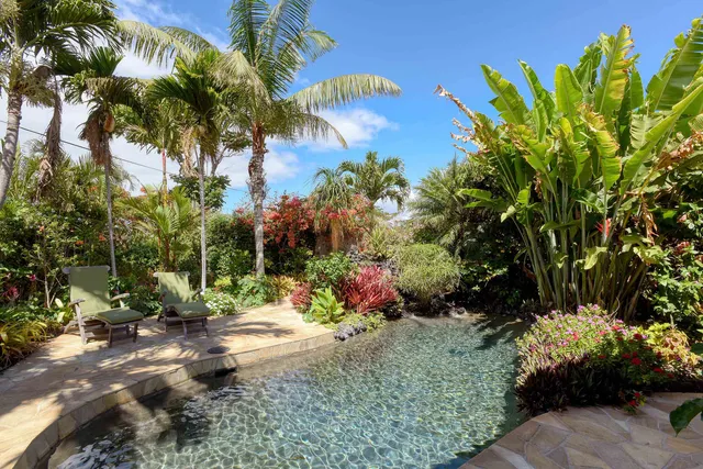 a backyard of a house with outdoor seating