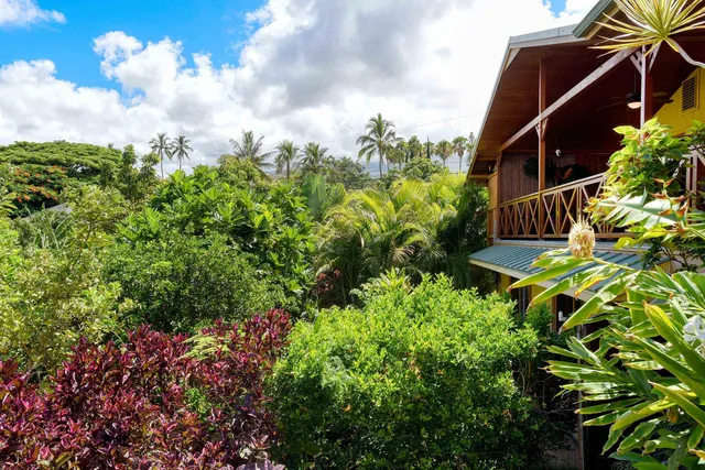 a view of balcony with furniture and potted plants