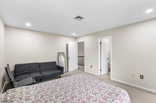 a living room with a couch and a rug