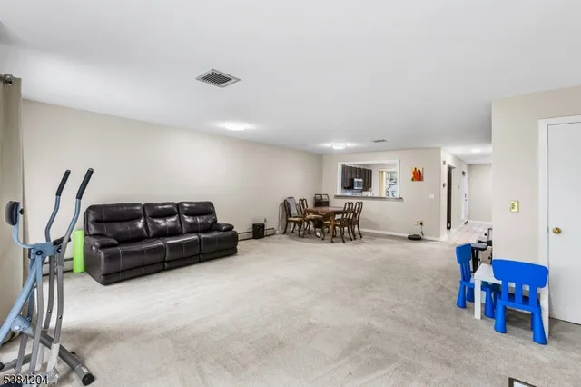 a living room with furniture and a chair