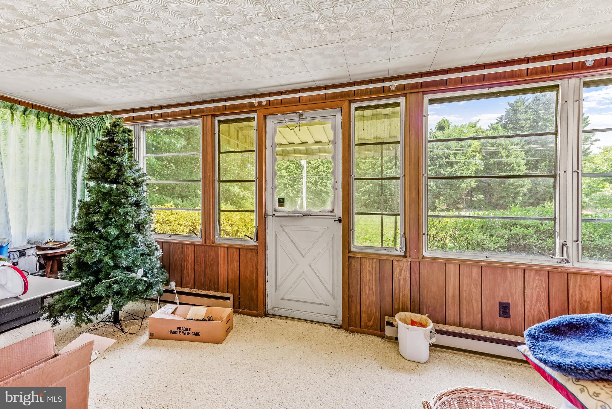 3695 Plum Point Road Huntingtown, MD 20639 - Photo 21 of 27 Great covered porch with so much light and space!