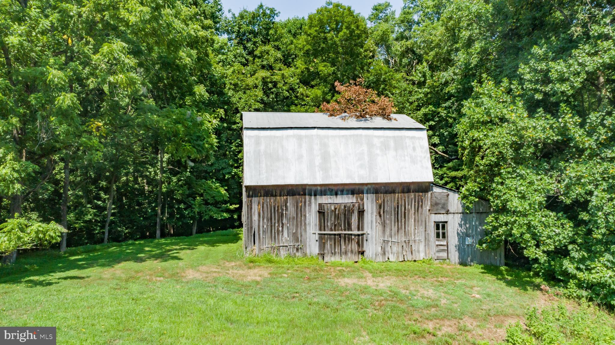 3695 Plum Point Road Huntingtown, MD 20639 - Photo 8 of 27 Small barn for storage or working shed.