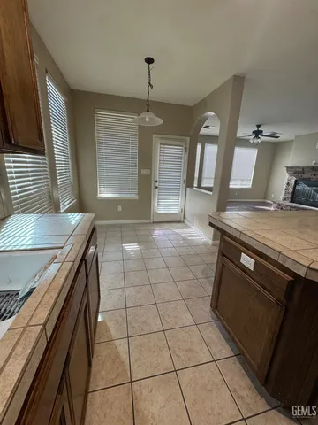 a kitchen with a stove a sink and a refrigerator