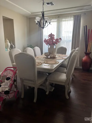 a dining room with furniture and window