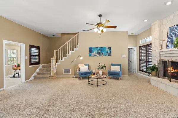 a view of a livingroom with furniture and a fireplace