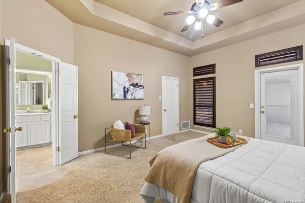 a room with pool table and windows