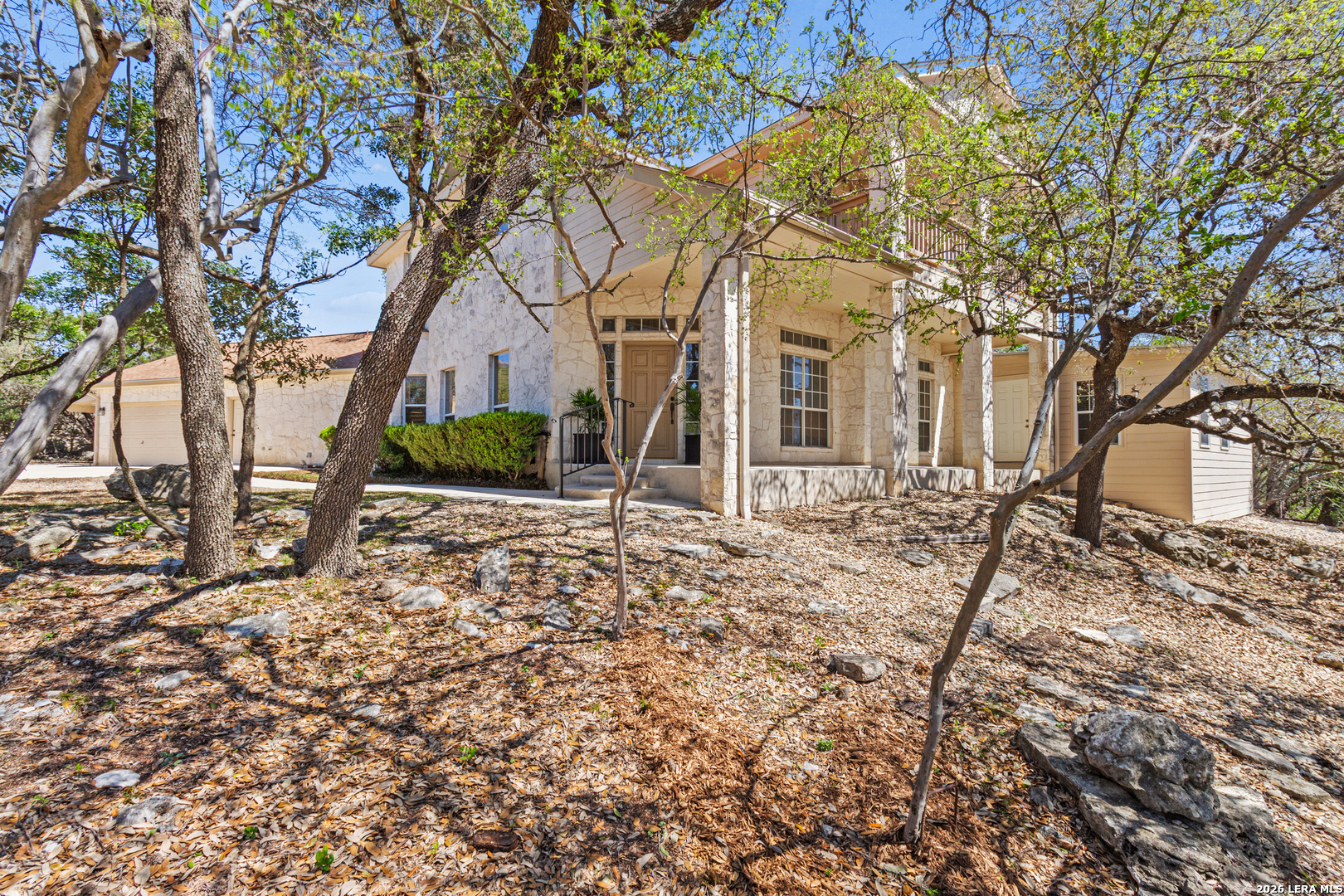 10219 Rafter O Trail Helotes, TX 78023 - Photo 2 of 39 a front view of a house with a yard