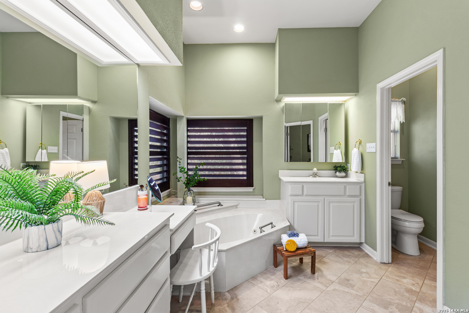 10219 Rafter O Trail Helotes, TX 78023 - Photo 23 of 39 a bathroom with a granite countertop sink mirror and toilet