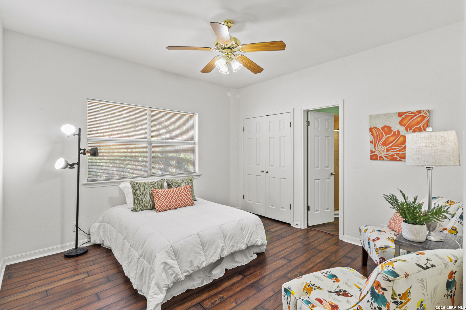 10219 Rafter O Trail Helotes, TX 78023 - Photo 24 of 39 a bedroom with a bed and wooden floor