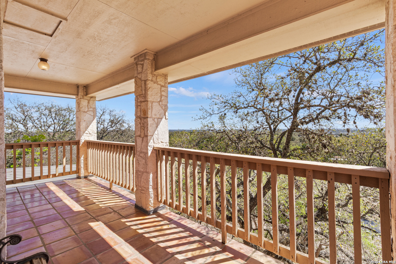 10219 Rafter O Trail Helotes, TX 78023 - Photo 26 of 39 a view of a balcony with wooden floor