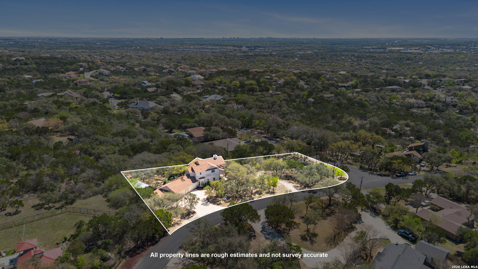 10219 Rafter O Trail Helotes, TX 78023 - Photo 5 of 39 an aerial view of a house with a yard