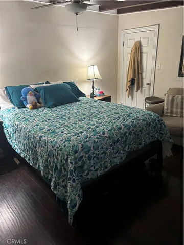 a bedroom with a bed and a mirror