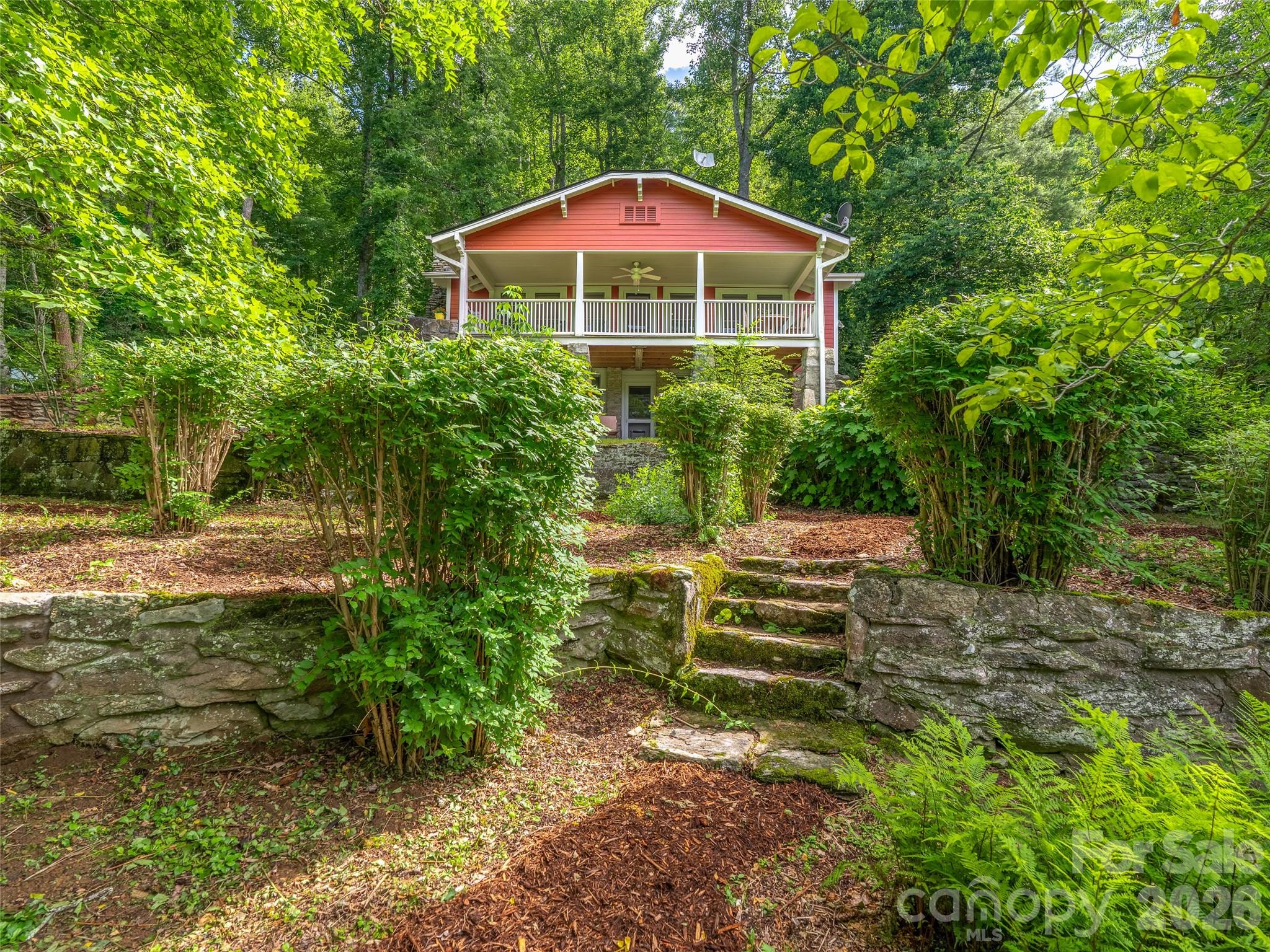 206 Chestnut Hill Road Gerton, NC 28735 - Photo 37 of 48 a view of a garden with an outdoor seating