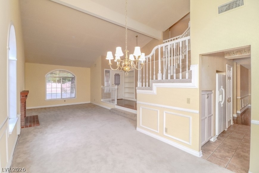 1429 Hawkwood Road Henderson, NV 89014 - Photo 7 of 53 Soaring vaulted ceilings and a brick fireplace create a welcoming focal point in this living area.