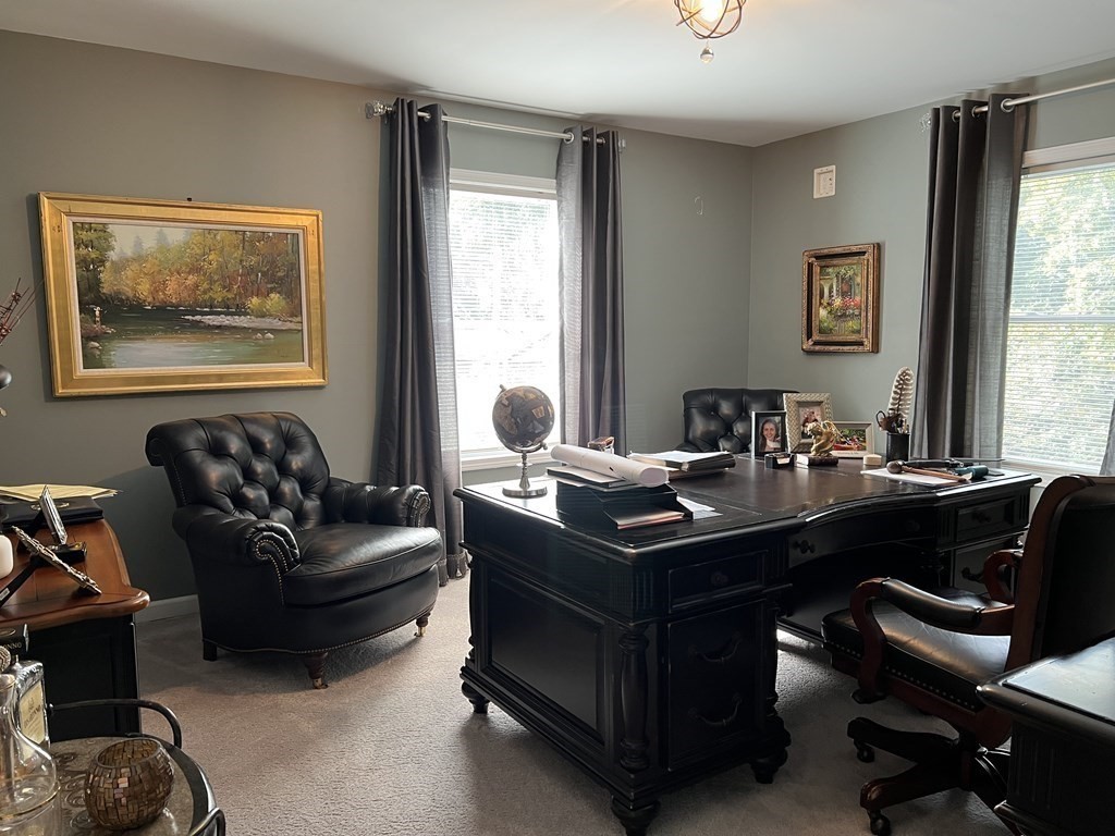 171 Forest Street Middleton, MA 01949 - Photo 17 of 35 a living room with furniture window and a table