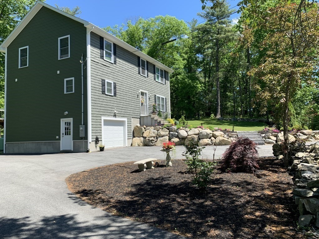 171 Forest Street Middleton, MA 01949 - Photo 2 of 35 a view of backyard of house with green space