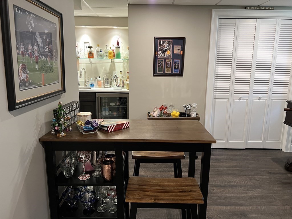 171 Forest Street Middleton, MA 01949 - Photo 27 of 35 a room with a table chairs and wooden floor