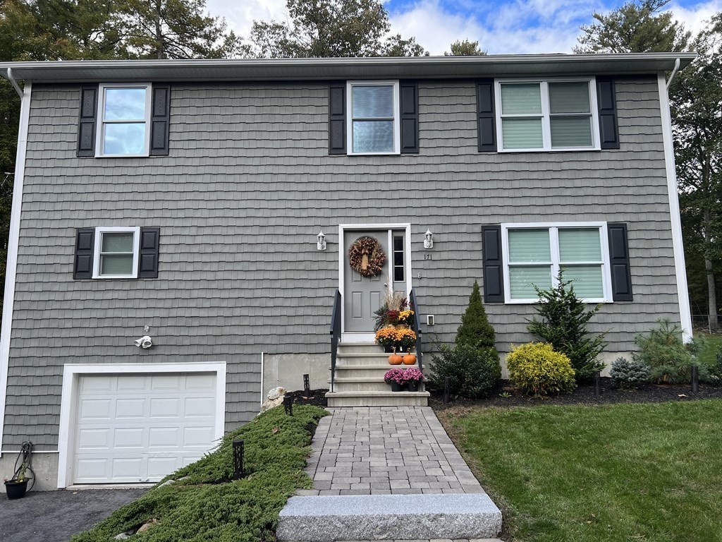 171 Forest Street Middleton, MA 01949 - Photo 31 of 35 a front view of a house with garden
