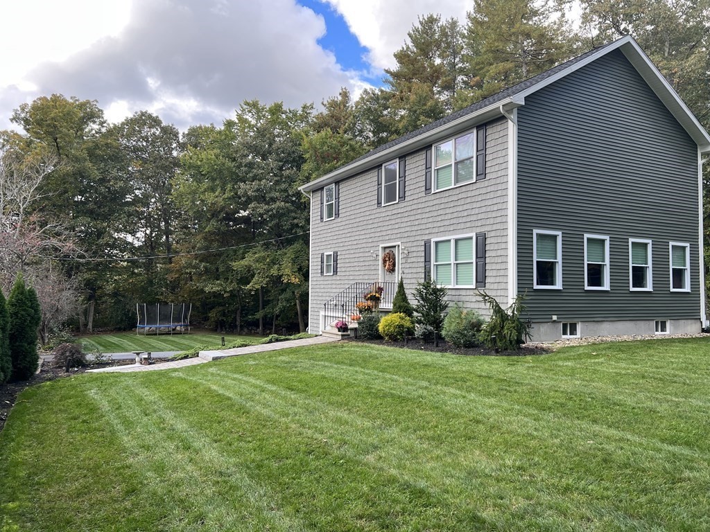 171 Forest Street Middleton, MA 01949 - Photo 32 of 35 a view of a house with backyard and sitting area