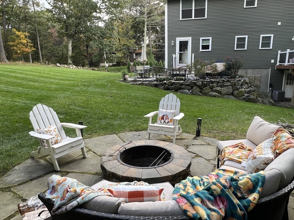 171 Forest Street Middleton, MA 01949 - Photo 34 of 35 a backyard of a house with seating space