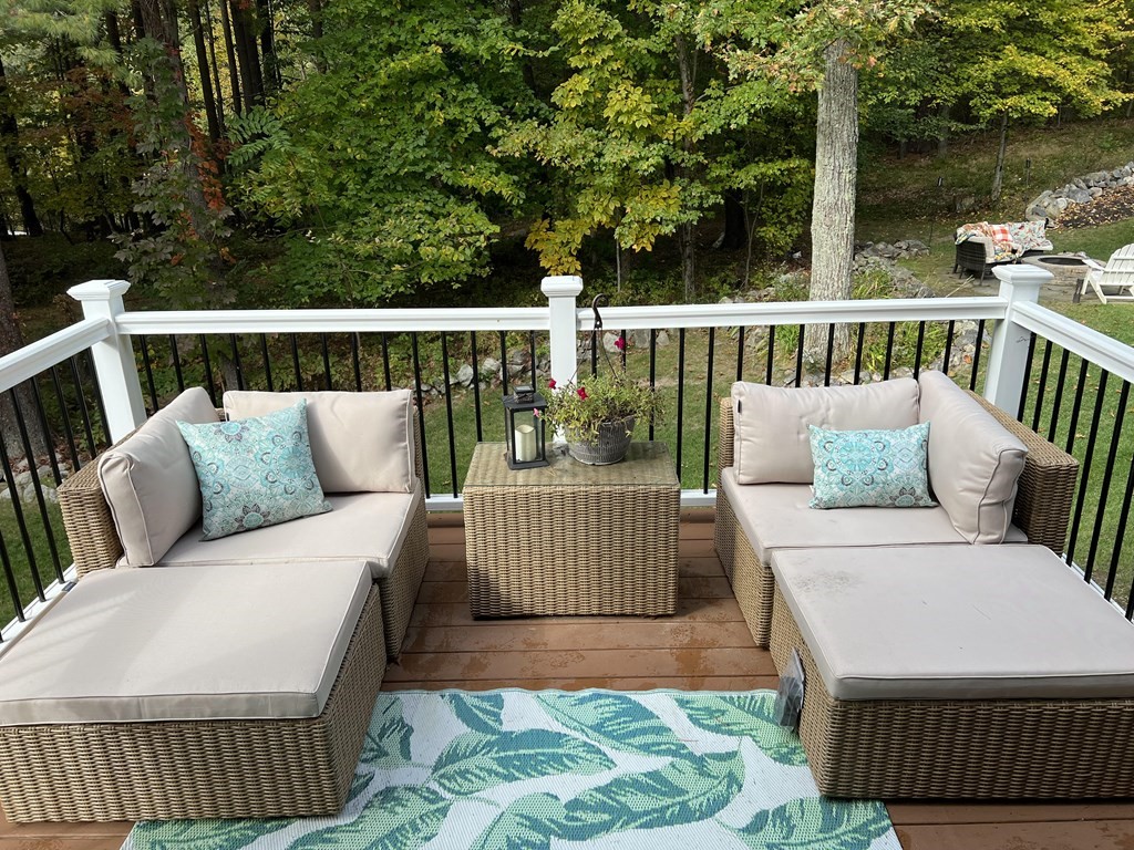 171 Forest Street Middleton, MA 01949 - Photo 35 of 35 a balcony with wooden floor and outdoor seating