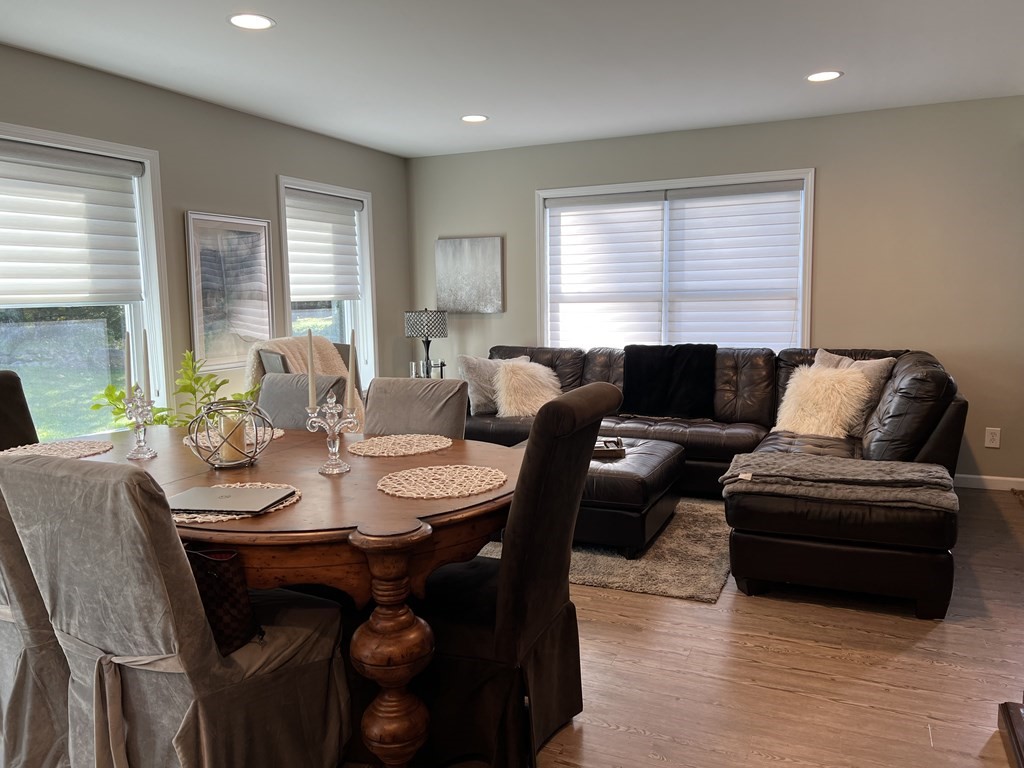 171 Forest Street Middleton, MA 01949 - Photo 7 of 35 a living room with furniture wooden floor and a large window