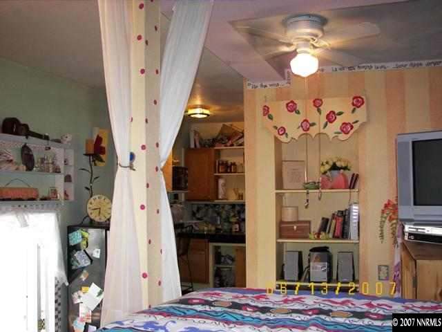 1142 California Avenue Reno, NV 89509 - Photo 5 of 9 a view of a bedroom with workspace and toys