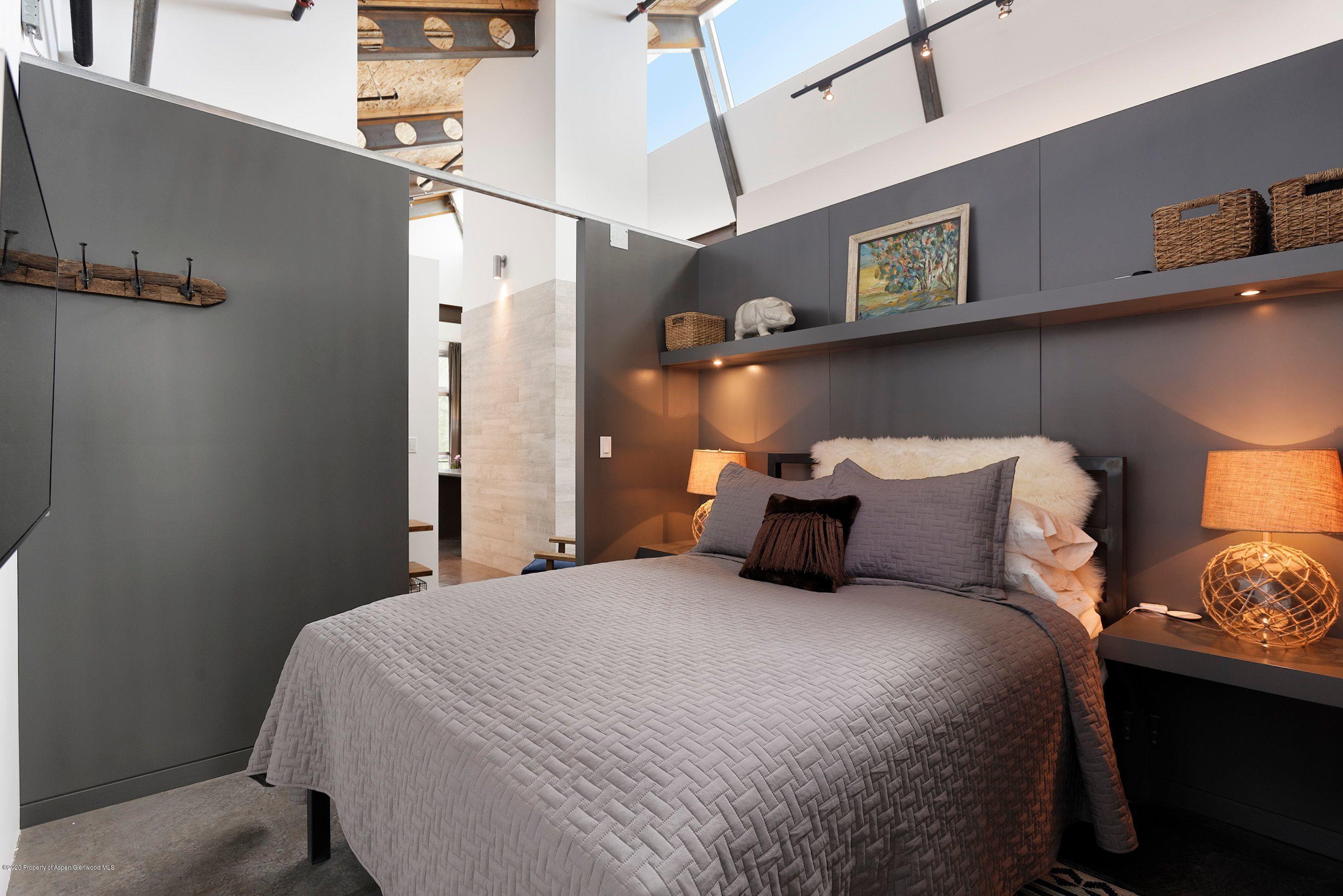 35 Widget Street, Unit 516 Basalt, CO 81621 - Photo 2 of 14 a bed room with a bed and a night stand