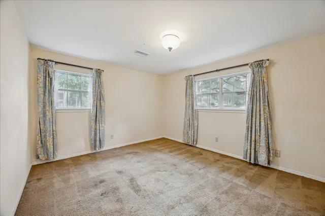 a spacious bathroom with a sink a toilet and shower