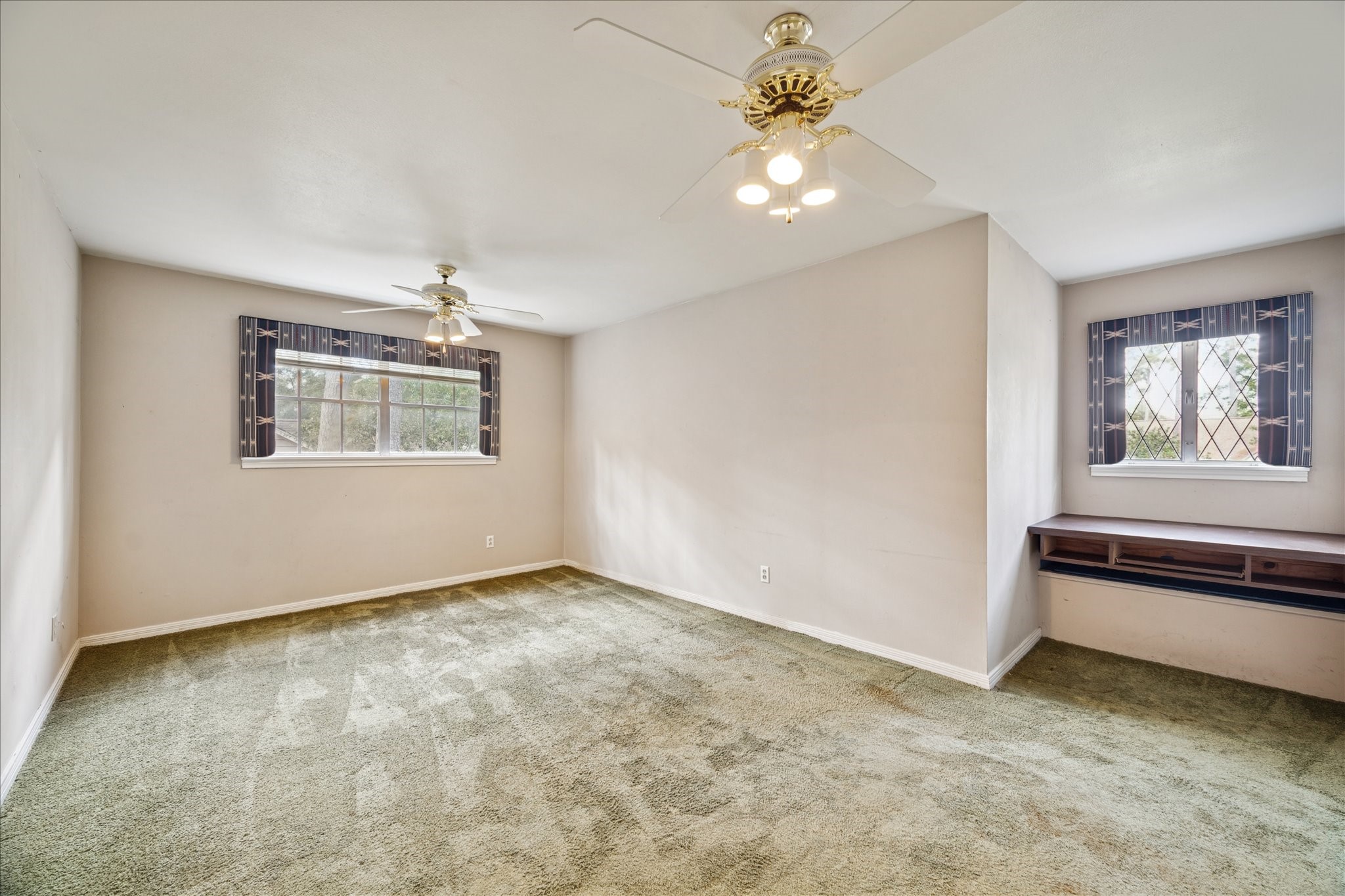 13603 Boca Raton Drive Houston, TX 77069 - Photo 17 of 27 an empty room with windows and fan