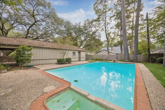 a view of a patio with a table and chairs