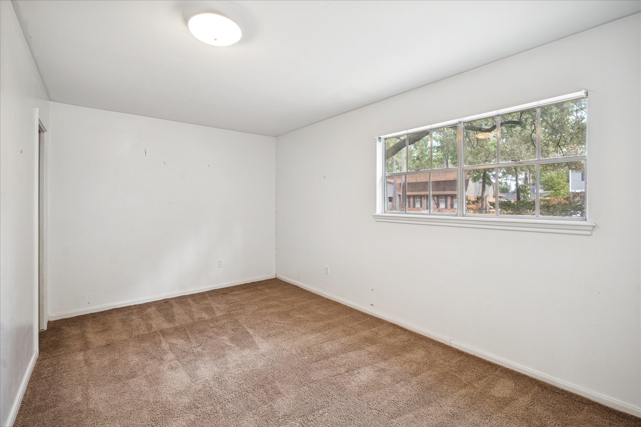 13603 Boca Raton Drive Houston, TX 77069 - Photo 23 of 27 an empty room with a window