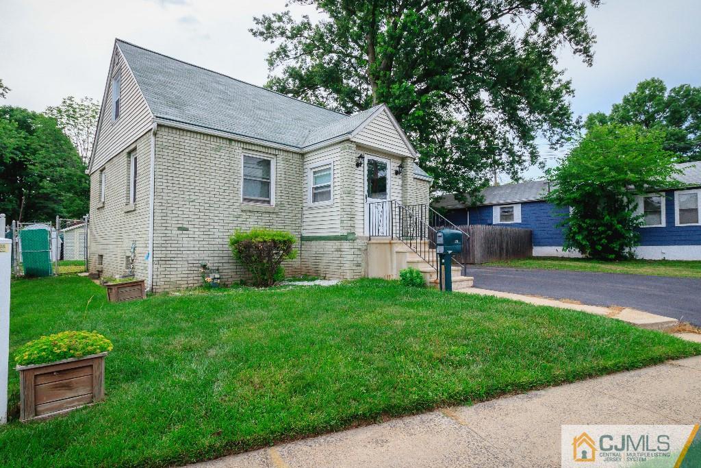 129 Middlesex Avenue Iselin, NJ 08830 - Photo 2 of 23 a front view of house with yard and green space