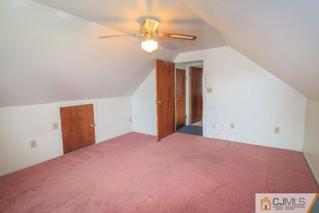 129 Middlesex Avenue Iselin, NJ 08830 - Photo 20 of 23 a view of a big room with closet and a ceiling fan