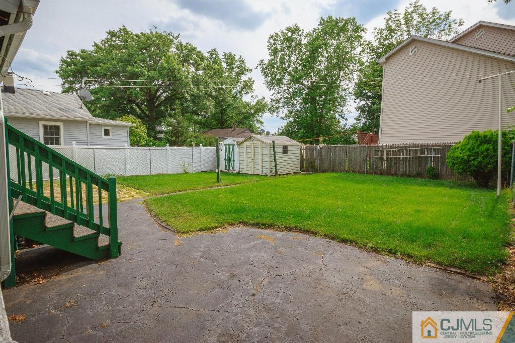 129 Middlesex Avenue Iselin, NJ 08830 - Photo 5 of 23 a view of a backyard with a small cabin