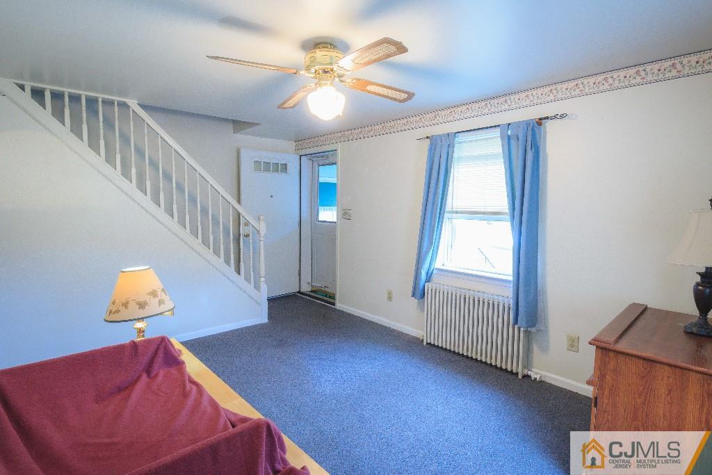 129 Middlesex Avenue Iselin, NJ 08830 - Photo 9 of 23 a view of an entryway with wooden floor
