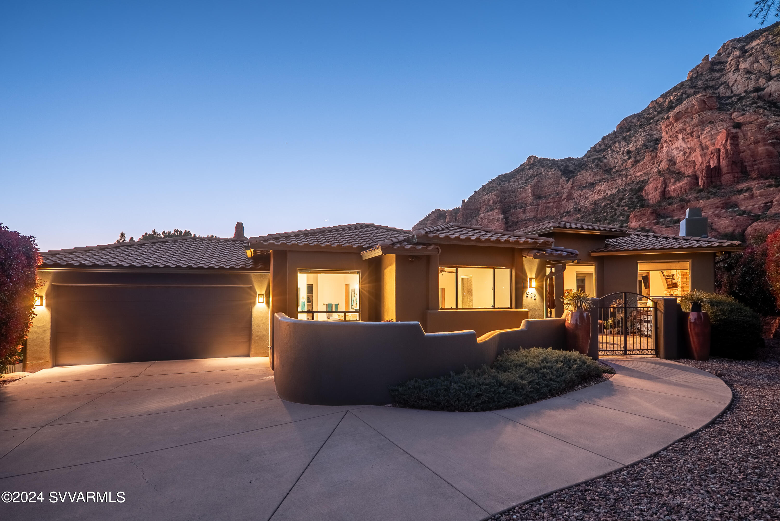 975 Rodeo Road Sedona, AZ 86336 - Photo 54 of 54 a front view of a house with a yard