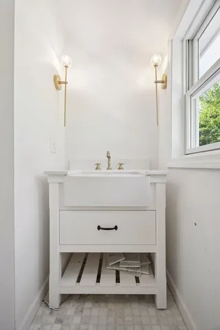 a bathroom with a sink and a mirror