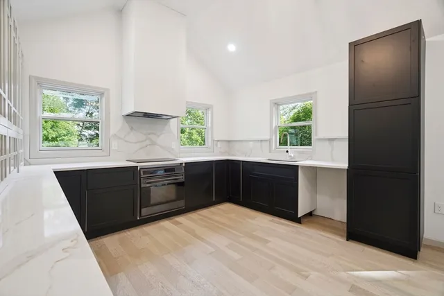 a kitchen with a refrigerator and a sink