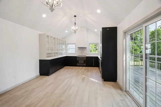 a kitchen with kitchen island a counter top space a sink and appliances