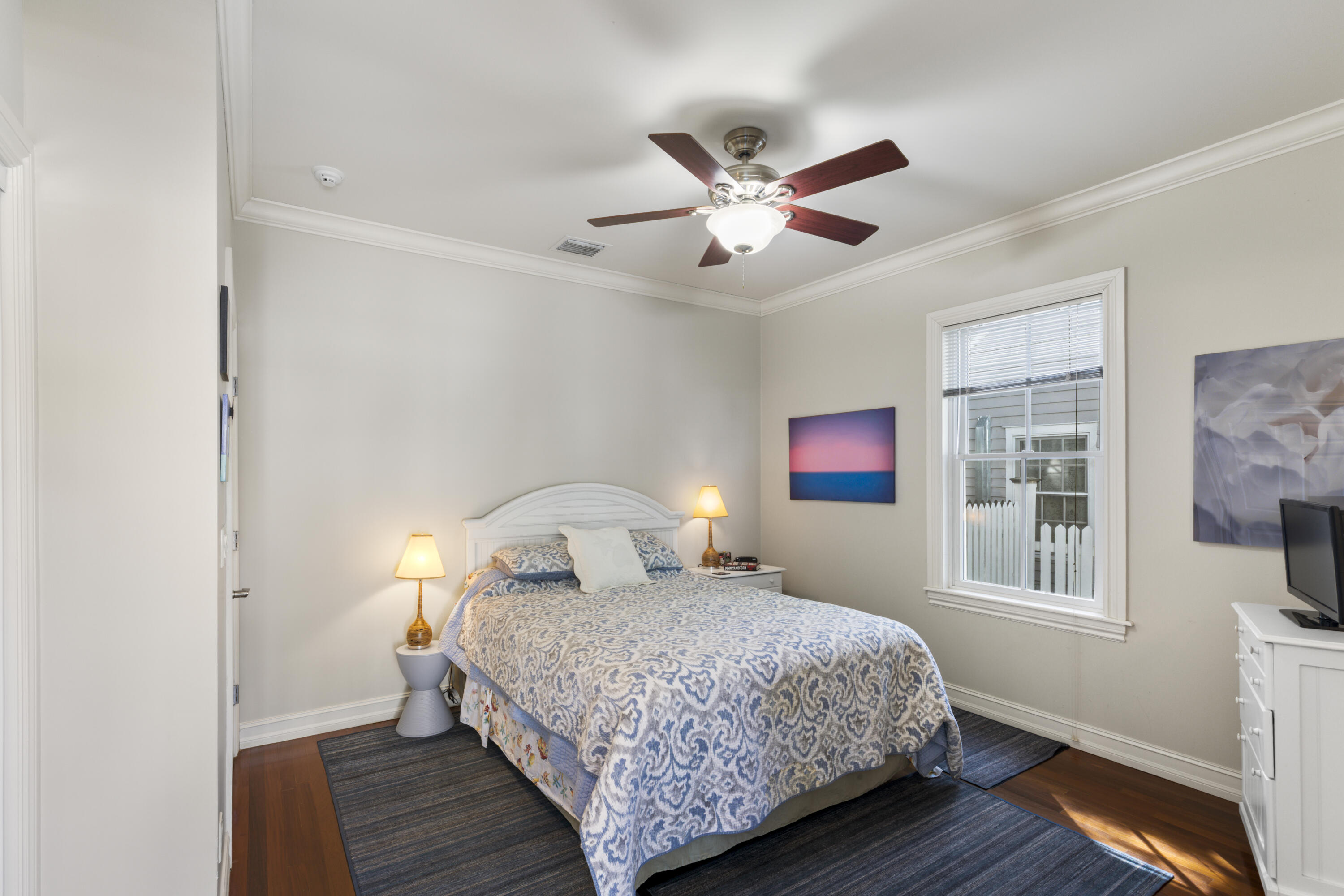 120 Angela Street, Unit 102 Key West, FL 33040 - Photo 11 of 24 a bedroom with a large bed and a window