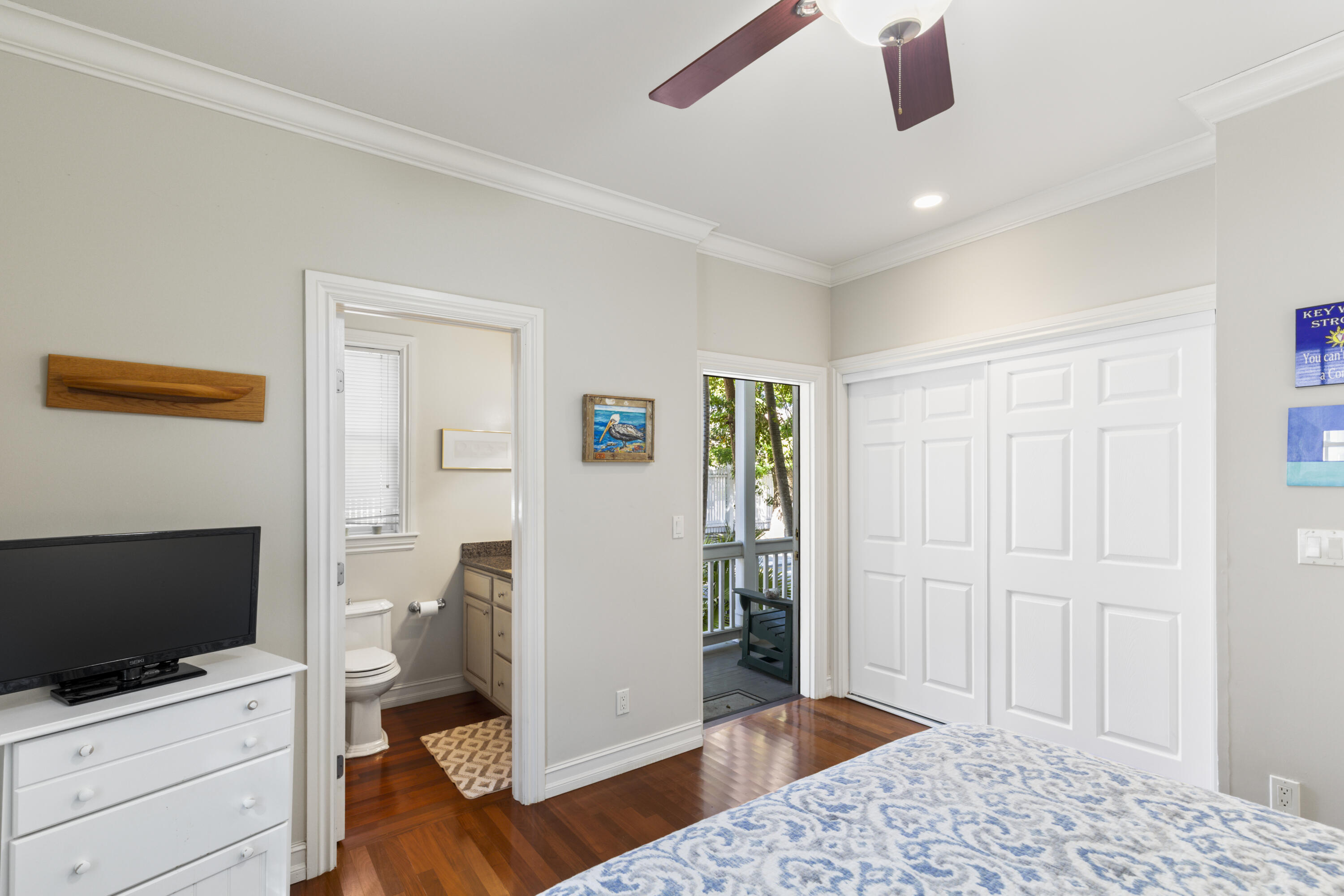 120 Angela Street, Unit 102 Key West, FL 33040 - Photo 12 of 24 a view of a livingroom with wooden floor and cabinet