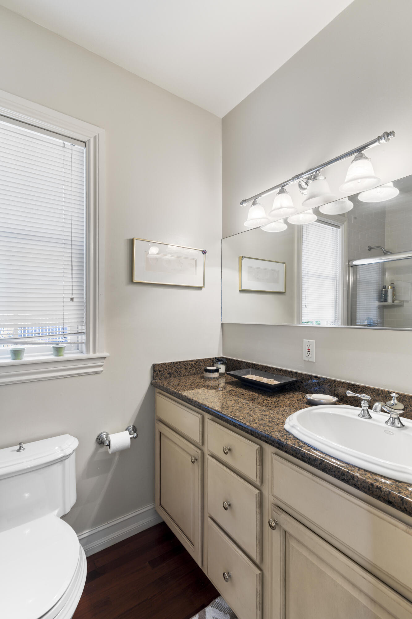 120 Angela Street, Unit 102 Key West, FL 33040 - Photo 14 of 24 a bathroom with a granite countertop sink toilet and mirror