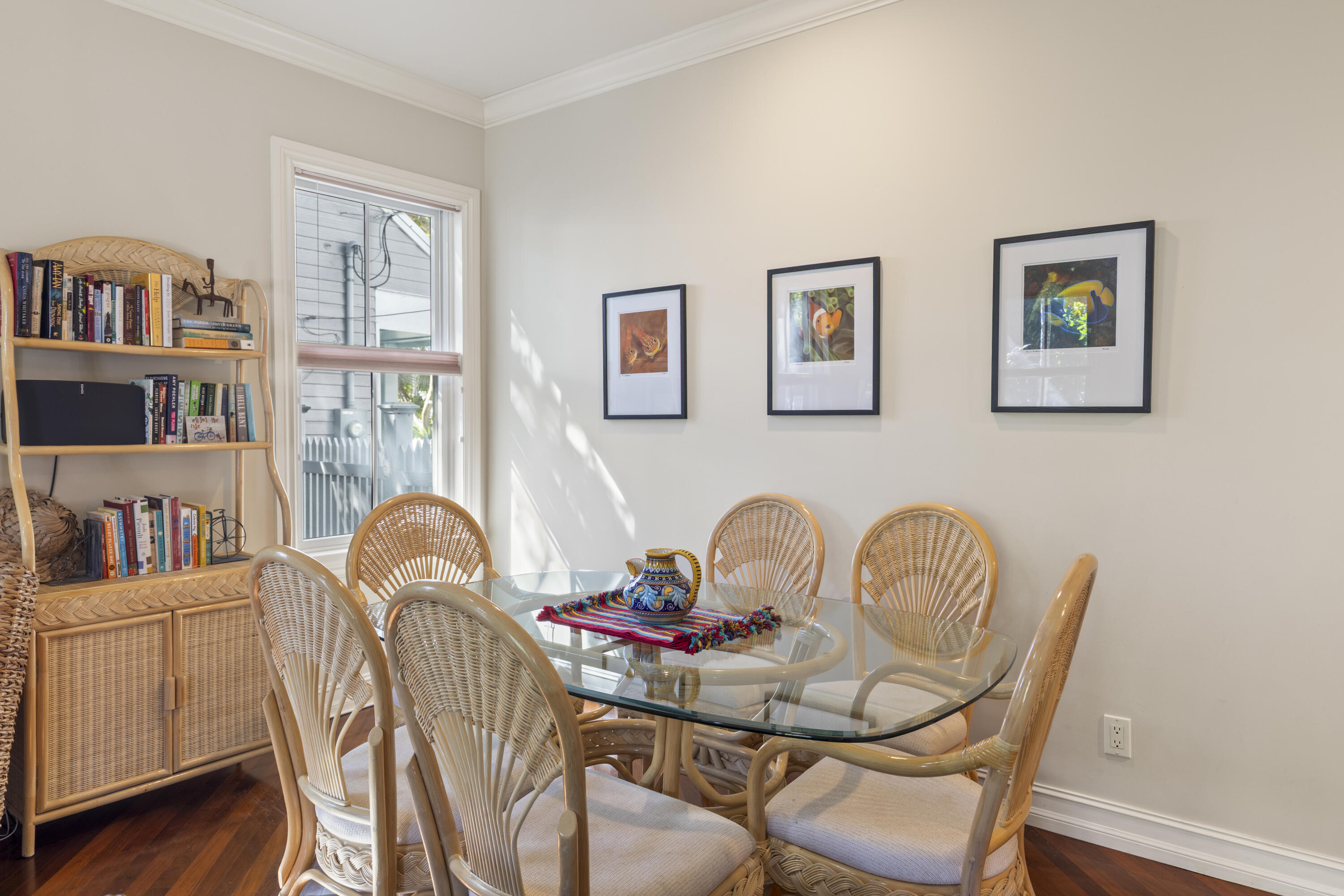 120 Angela Street, Unit 102 Key West, FL 33040 - Photo 9 of 24 a view of a dining room with furniture a rug and wooden floor